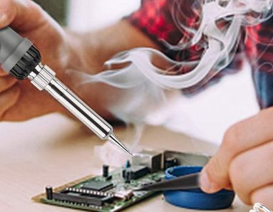Small image showing the hands of a person soldering